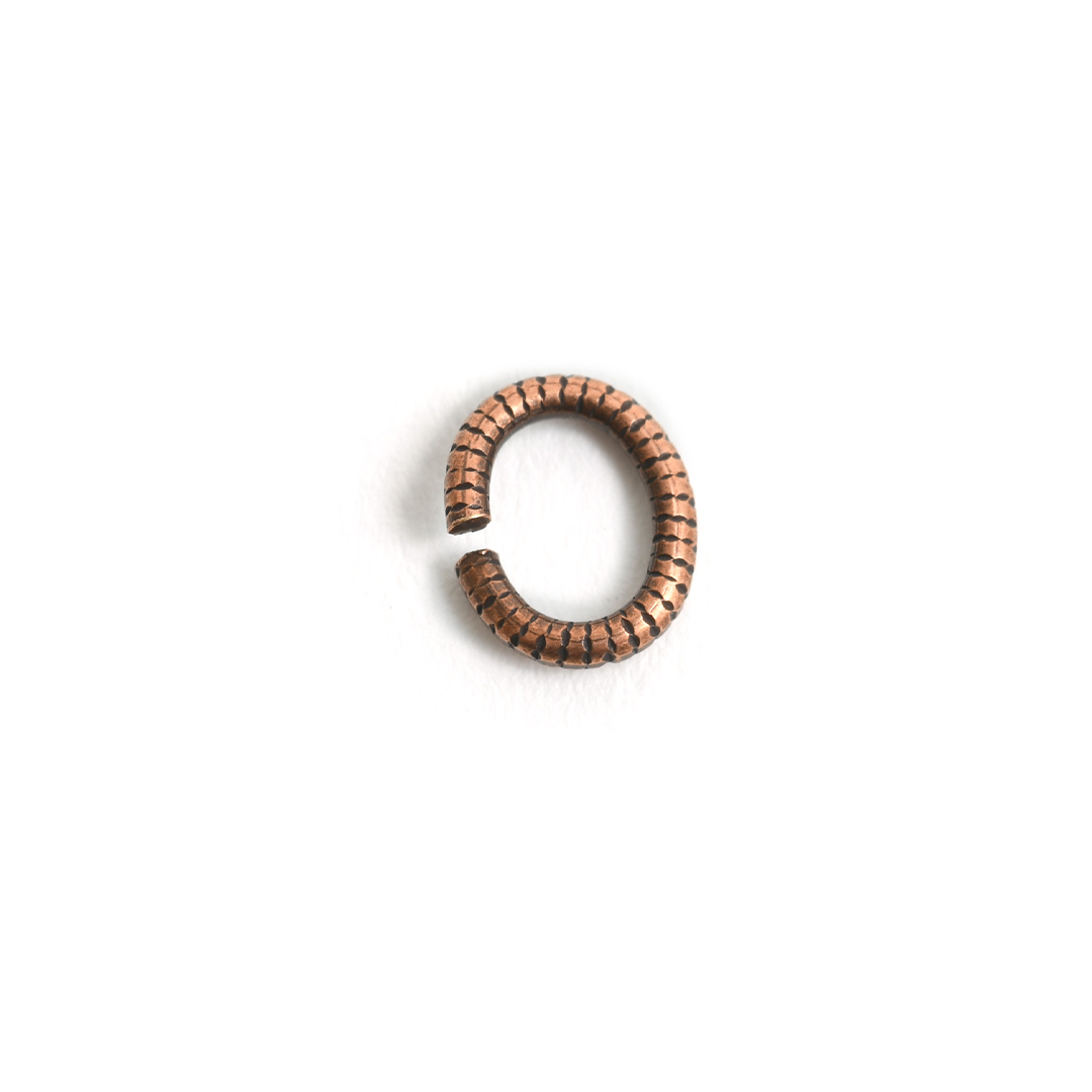 Jumpring 6mm Textured Oval<br>Antique Copper